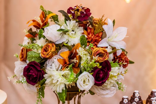 Vibrant floral bouquet with mixed flowers including roses and lilies, perfect for weddings.